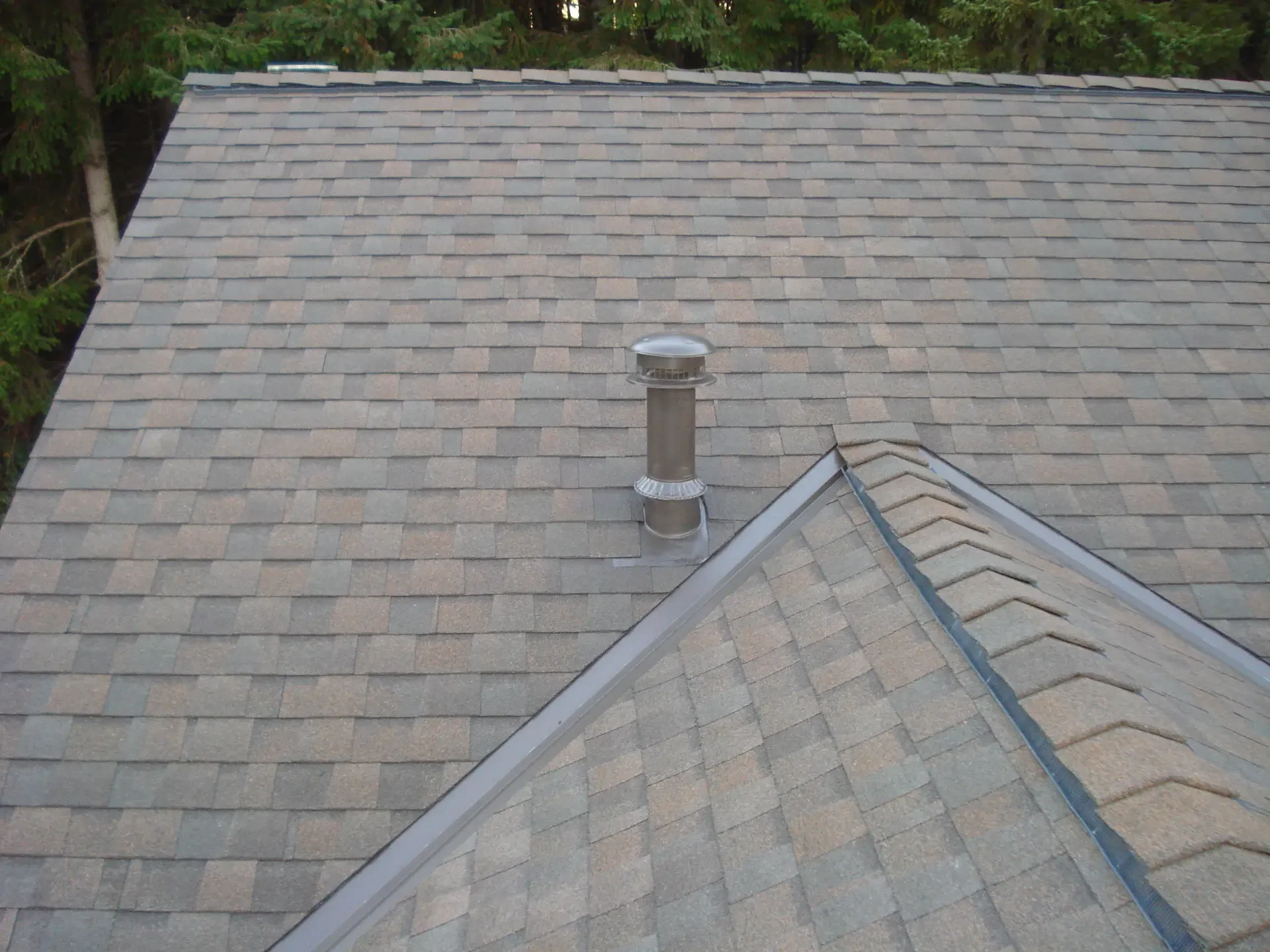 Roof vent flashing repaired to stop a rain leak on a Tacoma-area home